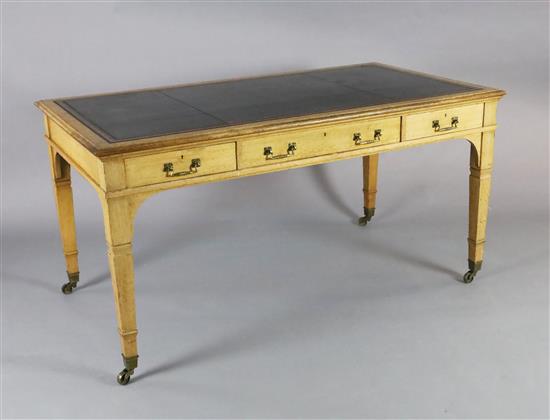 A late Victorian Gillows of Lancaster oak writing table, L.154cm